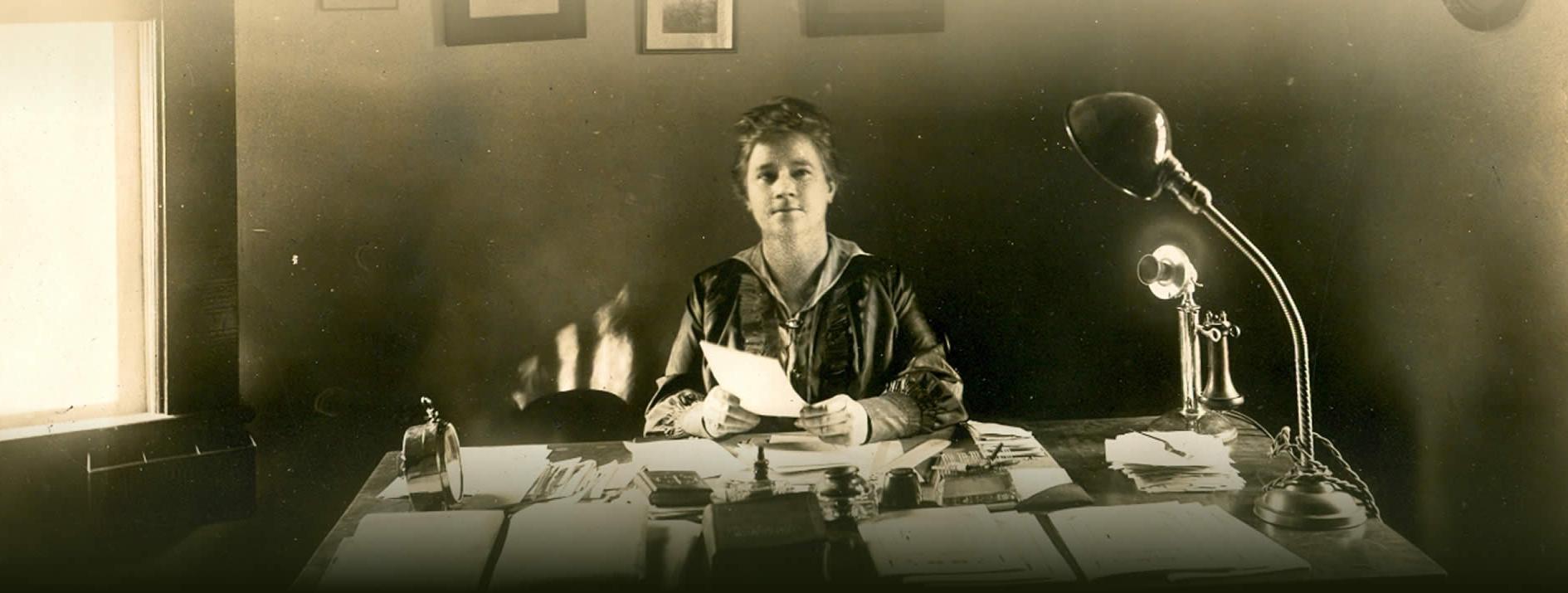 Martha Berry at her desk